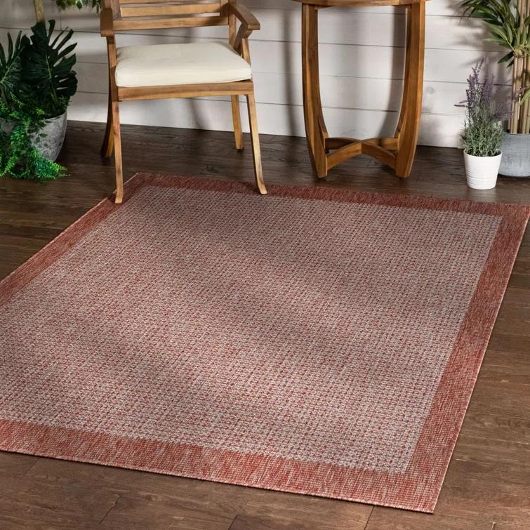Marshanna Odin Solid Striped Border Indoor Outdoor Coral Flatweave Rug