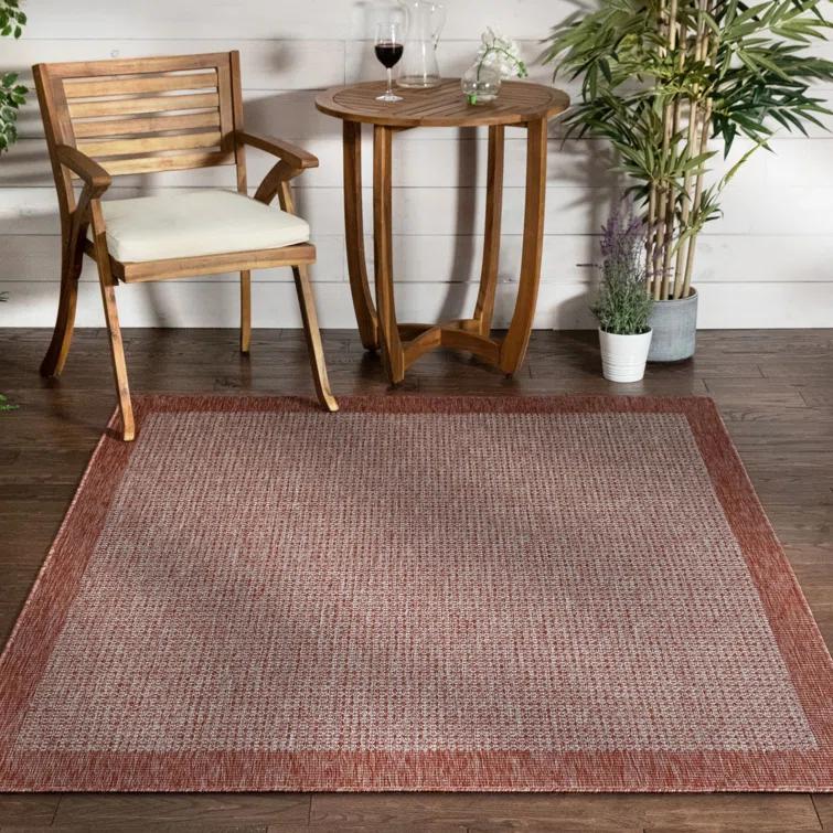 Marshanna Odin Solid Striped Border Indoor Outdoor Coral Flatweave Rug