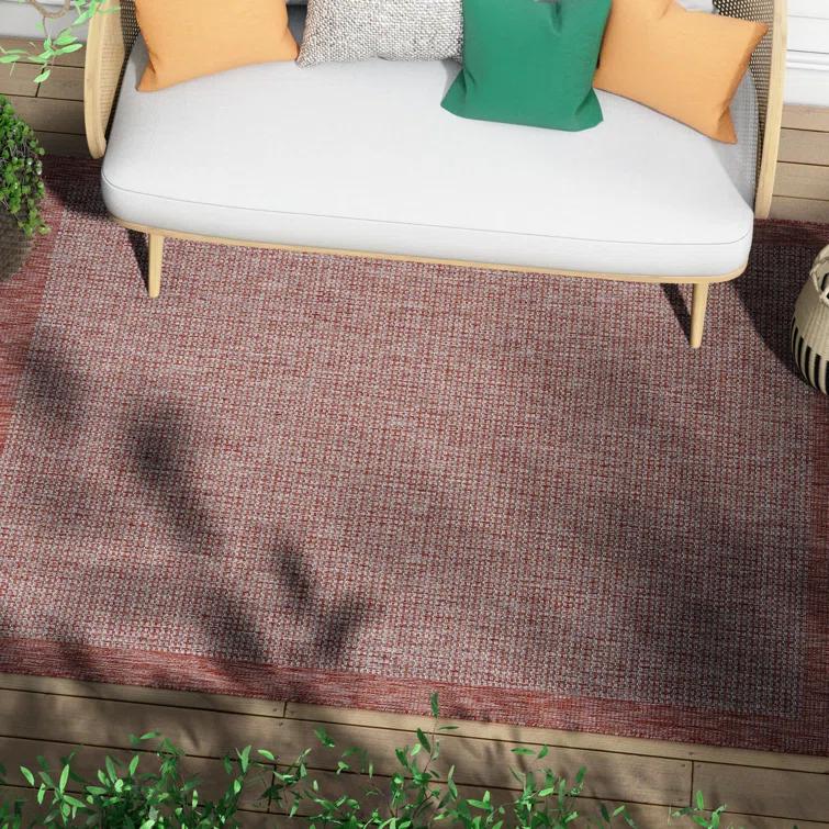Marshanna Odin Solid Striped Border Indoor Outdoor Coral Flatweave Rug