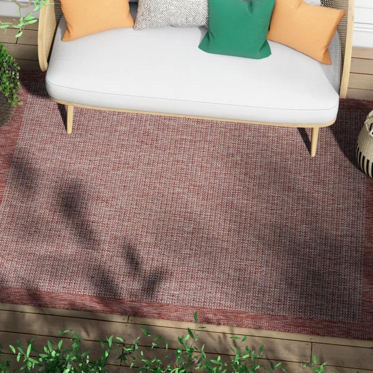 Marshanna Odin Solid Striped Border Indoor Outdoor Coral Flatweave Rug