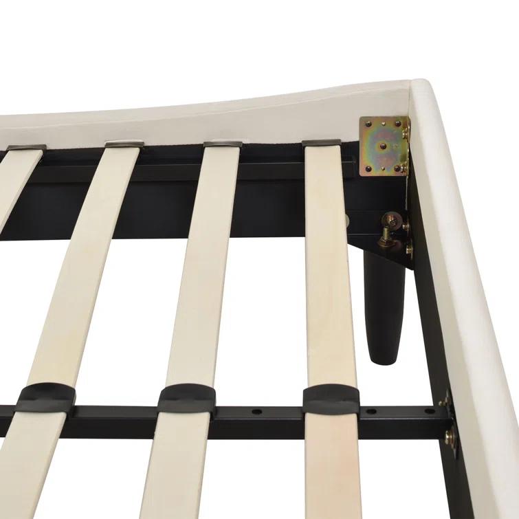 Afraa Upholstered Wingback Bed