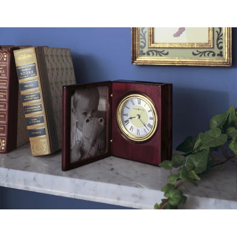 Howard Miller® Portrait Traditional Roman Numeral Quartz Movement / Crystal Tabletop Clock in Rosewood Hall/Polished Brass