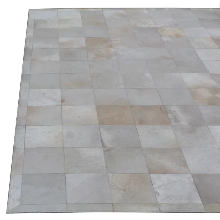 Exquisite Rugs Natural Hide Hand Stitched Leather Hide on Felt White Area Rug & Reviews | Wayfair