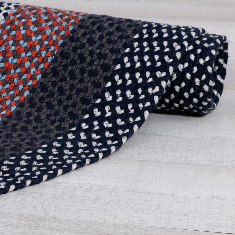 Enika Hand Braided Red/Blue Area Rug