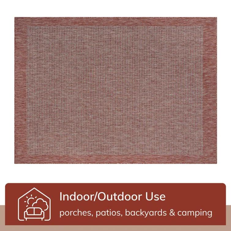 Marshanna Odin Solid Striped Border Indoor Outdoor Coral Flatweave Rug