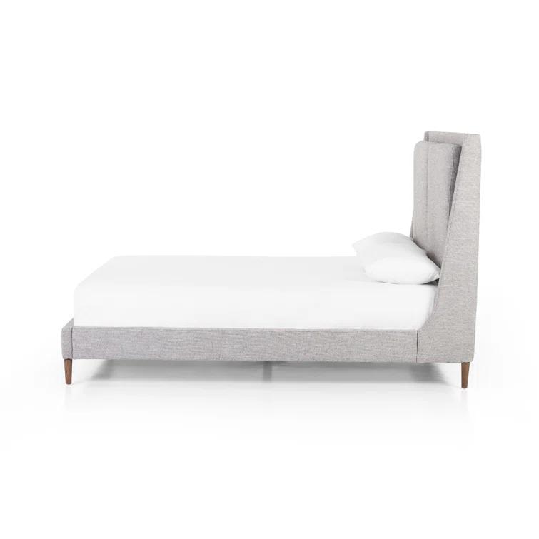 Gray Upholstered Queen Bed with Tapered Headboard and Wood Legs