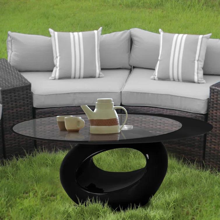 Orren Ellis Glass Top Coffee Table
