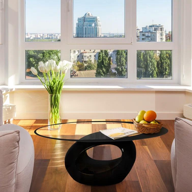 Orren Ellis Glass Top Coffee Table