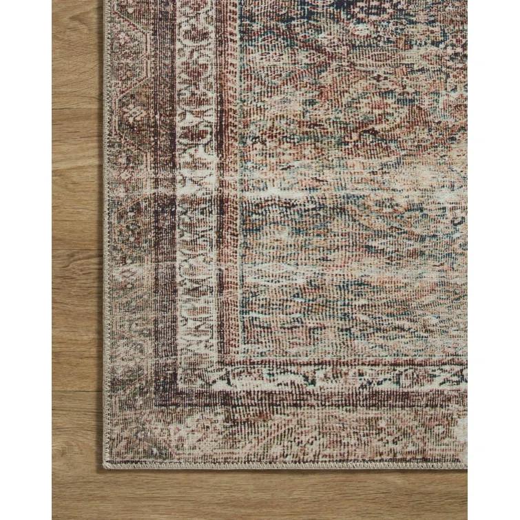 Jules Oriental Power Loomed Polyester Area Rug in Ink / Terracotta