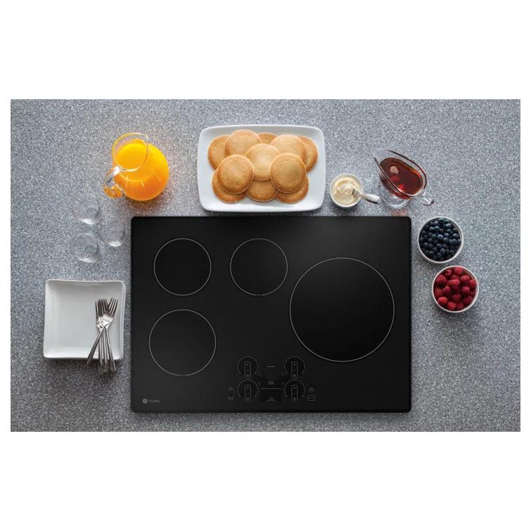 GE Profile™ PHP7030DTBB 29.75" Induction Cooktop with 4 Elements