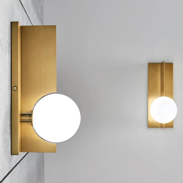 Orbel Geometric Aged Brass Wall Sconce with Frosted Glass Sphere