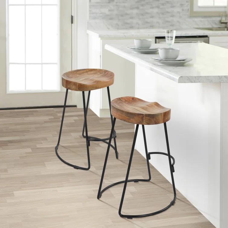 The Urban Port 24 Inch Mango Wood Industrial Counter Height Stool, Saddle Seat, Iron, Set of 2, Brown, Black
