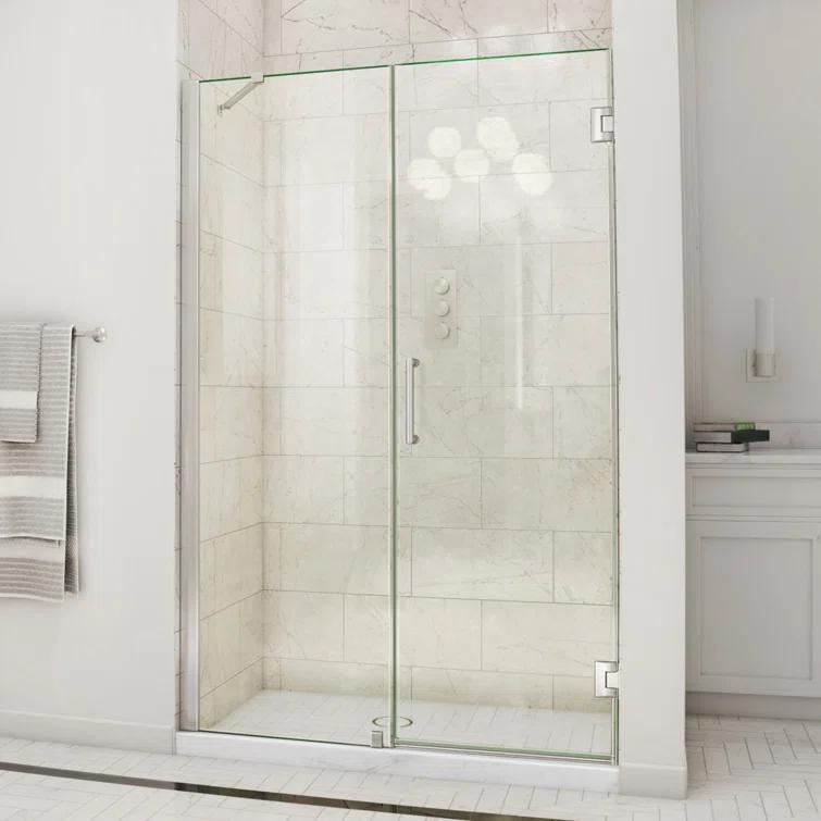 Unidoor 57" W x 72" H Hinged Frameless Shower Door and Fixed Panel with ClearMax Glass Treatment