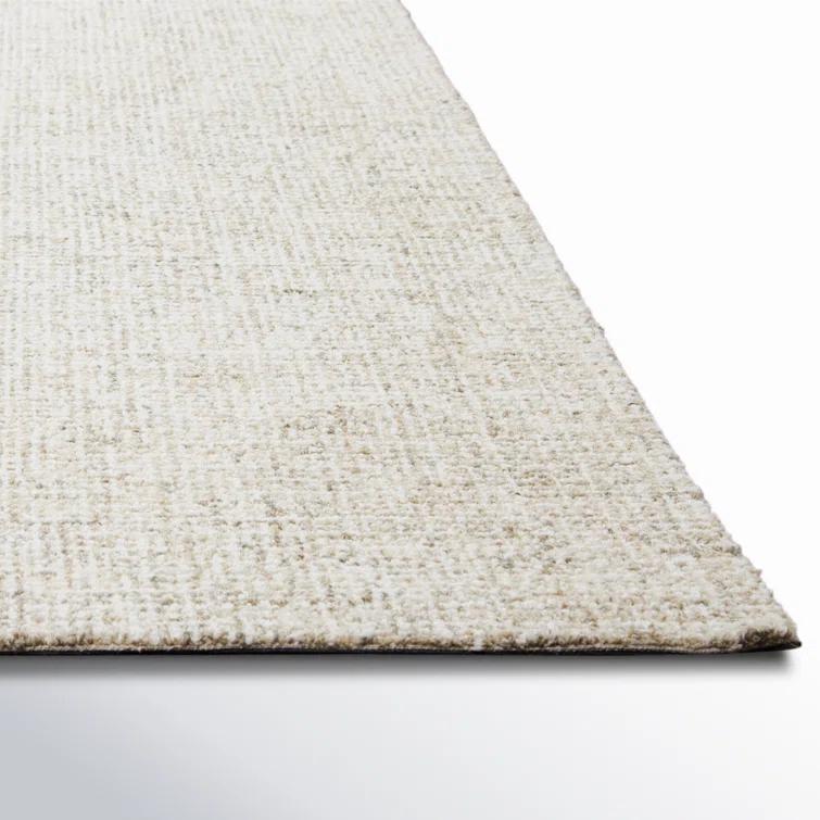 Britley Handmade Tufted Wool Beige Area Rug