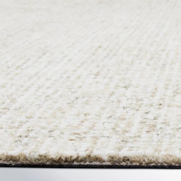 Britley Handmade Tufted Wool Beige Area Rug