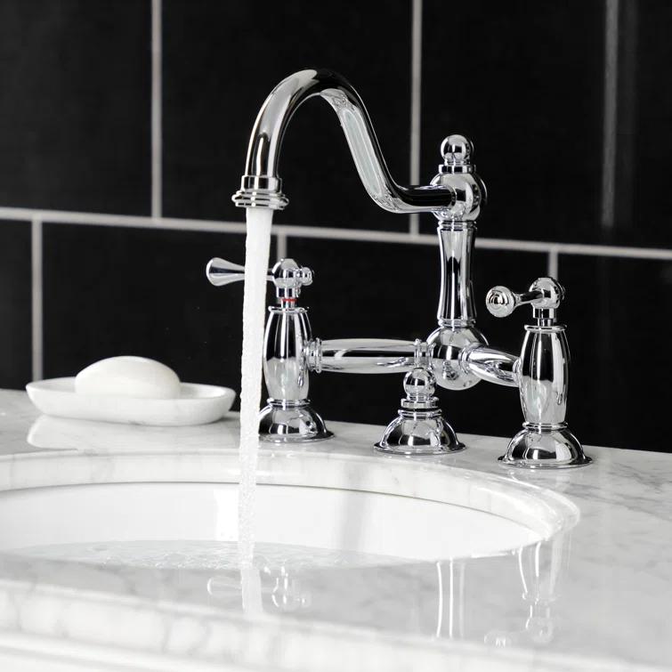 Kingston Brass Restoration Two-Handle 3-Hole Deck Mount Bridge Bathroom Faucet with Brass Pop-Up
