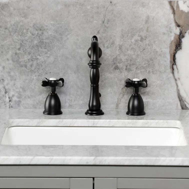 Kingston Brass Heritage Two-Handle 3-Hole Deck Mount Widespread Bathroom Faucet with Pop-Up Drain