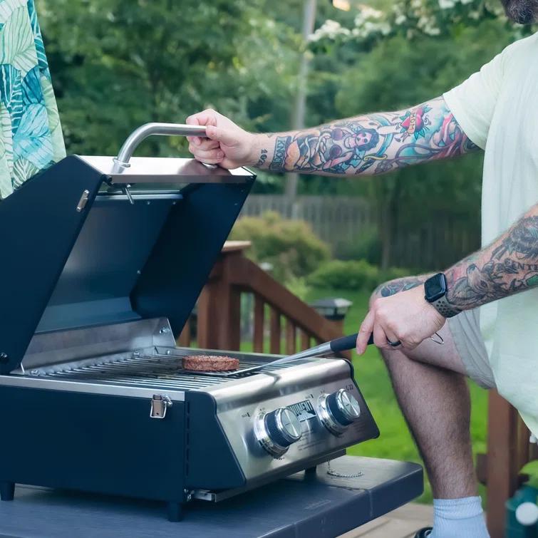 Monument Grills 13742,2-Burner Portable Stainless Steel Tabletop Propane Gas Grill with High Lid and Travel Locks, 15,000 BTU – Perfect for Family BBQs