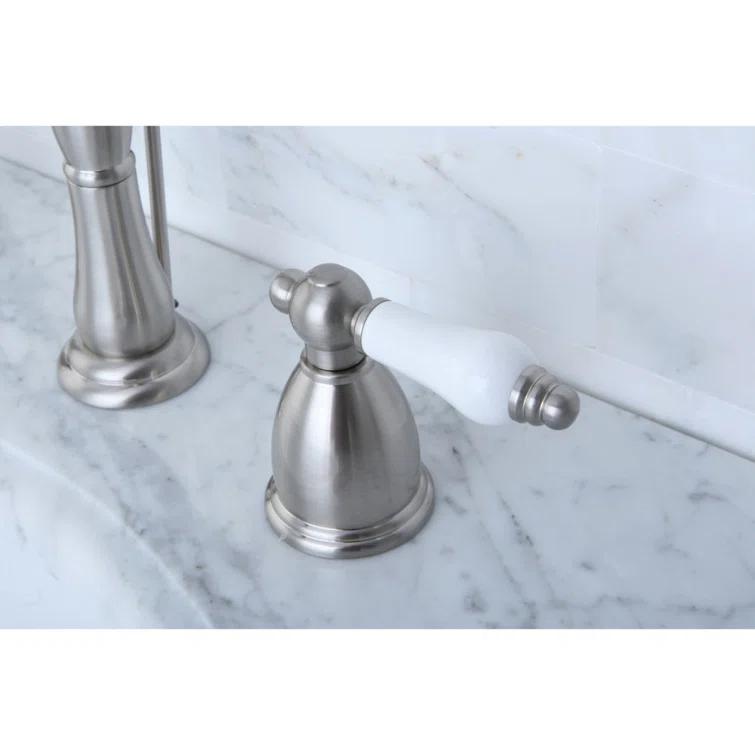 Kingston Brass Heritage Two-Handle 3-Hole Deck Mount Widespread Bathroom Faucet with Pop-Up Drain