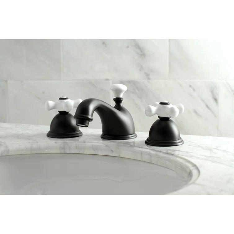 Kingston Brass Restoration Two-Handle 3-Hole Deck Mount Widespread Bathroom Faucet with Brass Pop-Up Drain