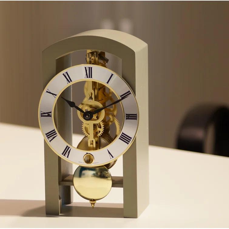 Gray and Gold Mechanical Table Clock with Open Design