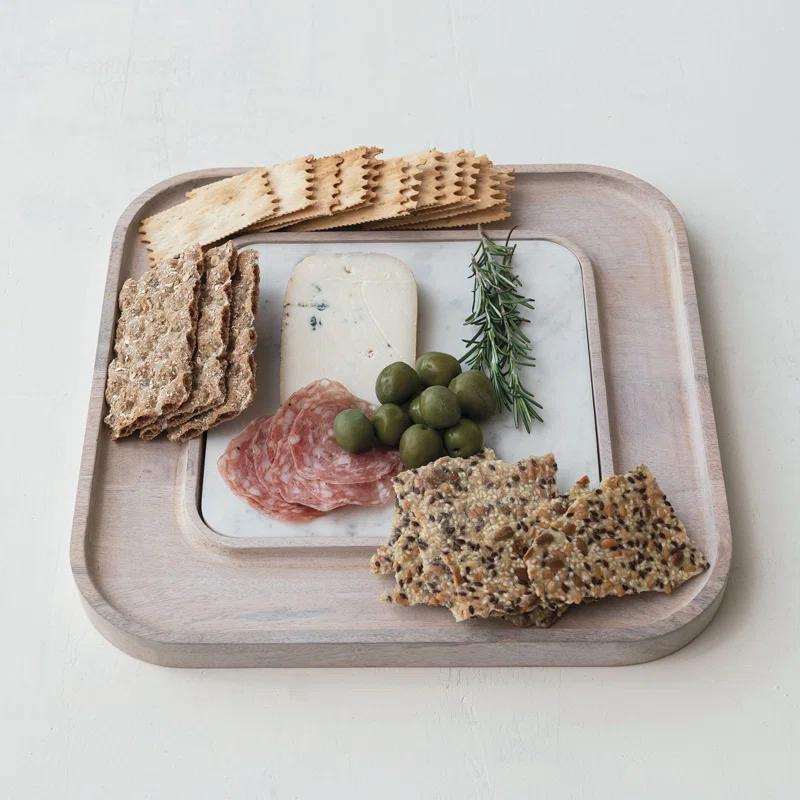 Creative Co-Op Marble And Wood Cutting Board On A Dish