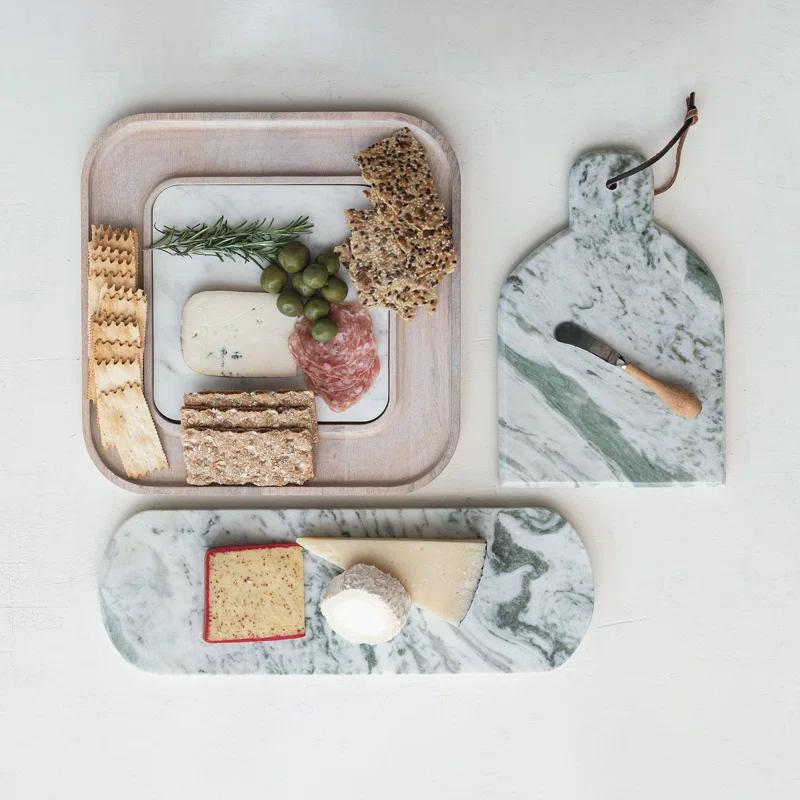 Creative Co-Op Marble And Wood Cutting Board On A Dish