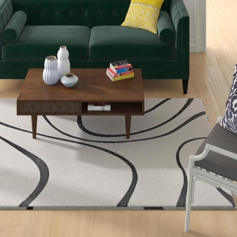 Ivory and Charcoal Abstract Swirl 5' x 8' Synthetic Area Rug