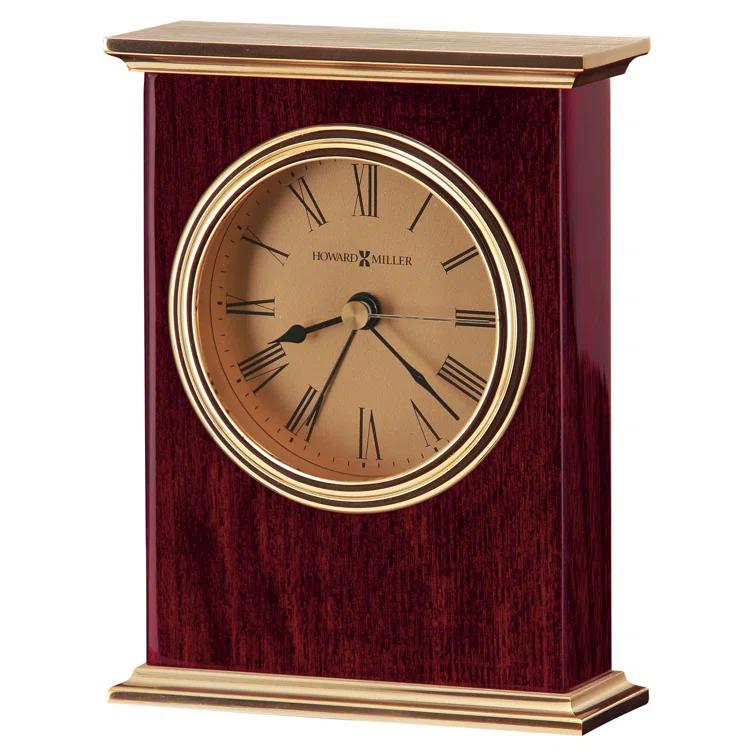 Howard Miller® Laurel Traditional Roman Numeral Wood Quartz Movement / Crystal Tabletop Clock with Alarm in Rosewood Hall/Polished Brass