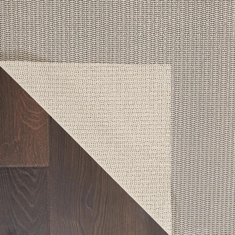 Ebern Designs Rectangle Shiftloc Solid Color Machine Made Polyester/Plastic/Acrylic Area Rug in Ivory