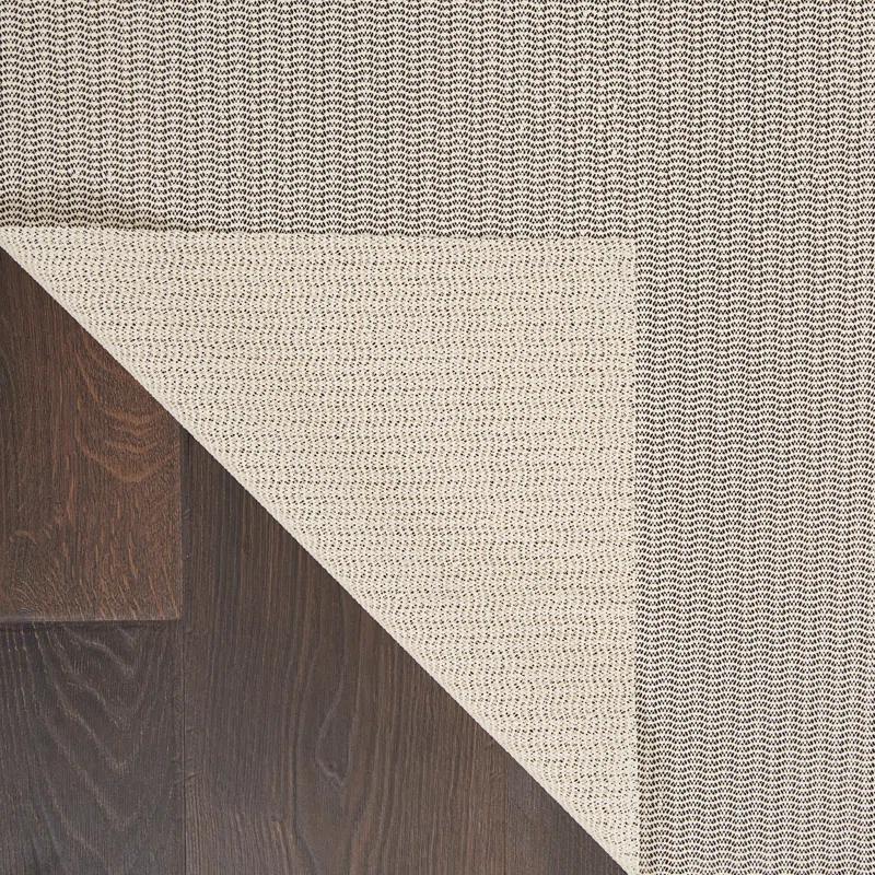 Ebern Designs Rectangle Shiftloc Solid Color Machine Made Polyester/Plastic/Acrylic Area Rug in Ivory