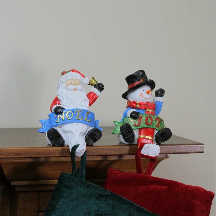 The Holiday Aisle® 2 Piece Glittered Santa and Snowman Stocking Holder Set