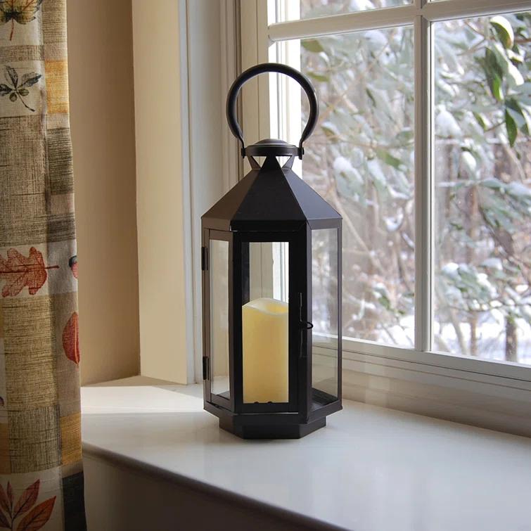 The Holiday Aisle® Black Hexagon Metal Lantern with Battery-Operated Candle