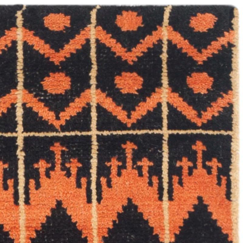 Union Rustic Alimatou Hand Knotted Wool/Cotton Southwestern Rug in Orange/Black
