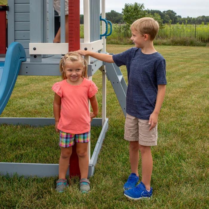 Backyard Discovery Backyard Discovery Beacon Heights Cedar Wooden Elevated Kids Playhouse with Wave Slide, Play Kitchen, and Deck