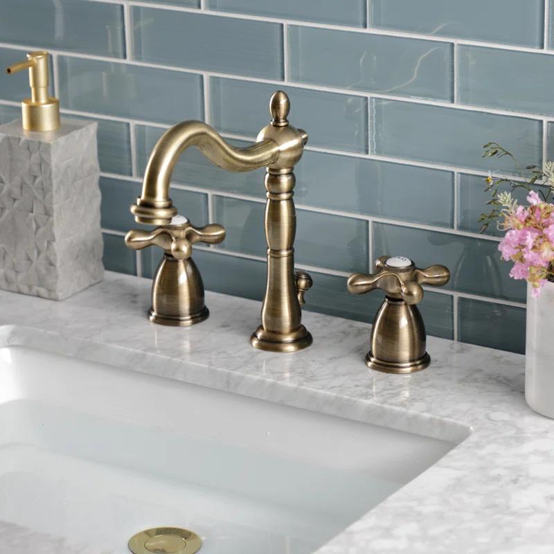 Kingston Brass Heritage Two-Handle 3-Hole Deck Mount Widespread Bathroom Faucet with Pop-Up Drain