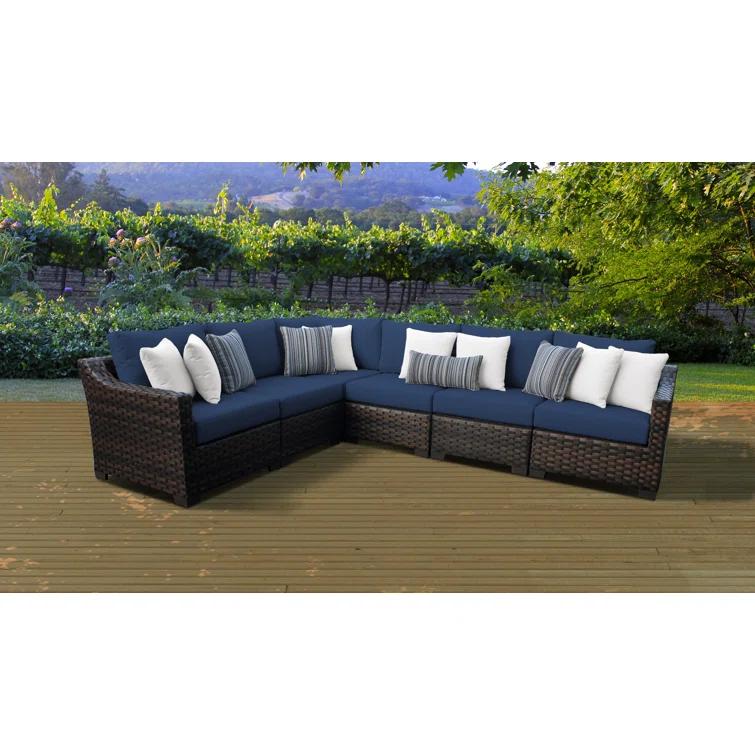 kathy ireland Homes & Gardens by TK Classics 126'' Wide Wicker Patio Sectional with Cushions