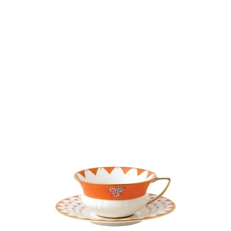 Orange and White Ceramic Teacup and Saucer Set