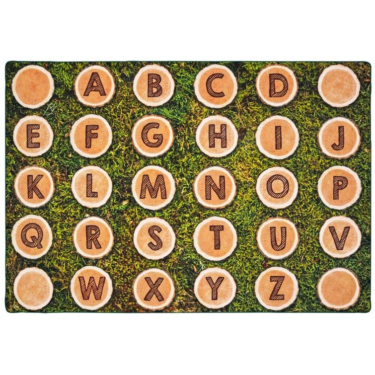 Carpets for Kids Pixel Perfect™ Alphabet Wood Stumps in Grass Tufted Brown/Green Area Rug