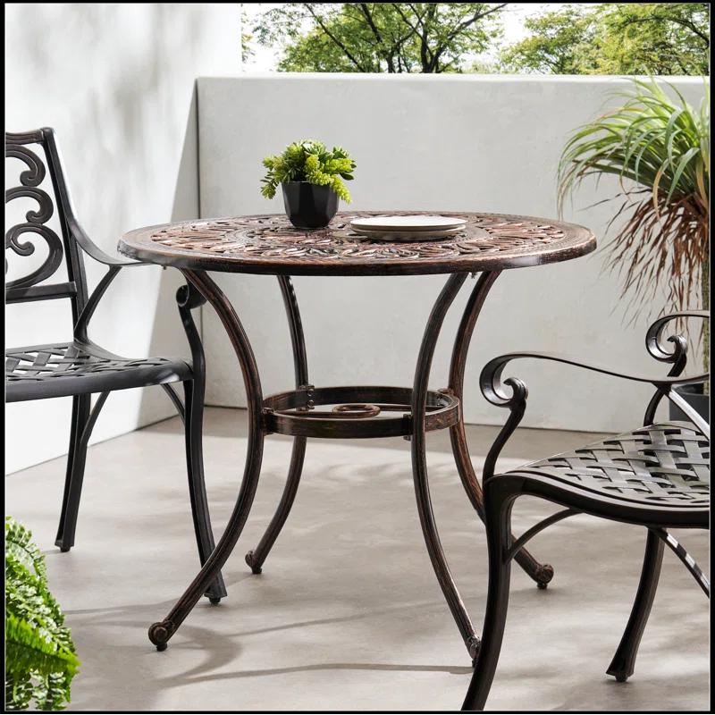 Fleur De Lis Living Outdoor Round Cast Aluminum Dining Table, Shiny Copper | Wayfair