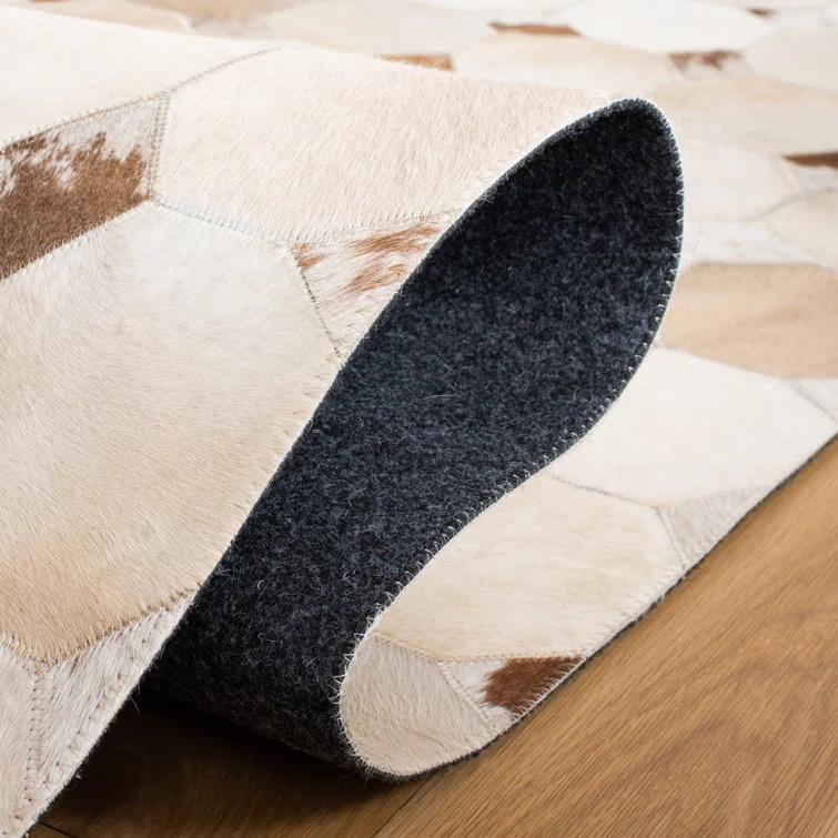 Loon Peak® Bersa Flat Weave Hair On Leather Geometric Rug