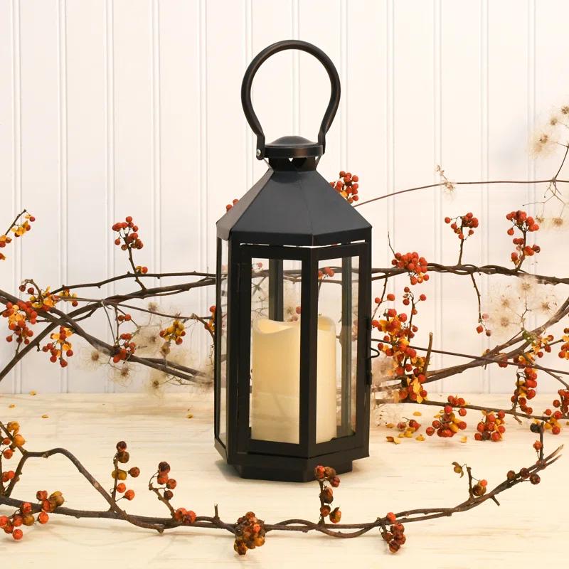The Holiday Aisle® Black Hexagon Metal Lantern with Battery-Operated Candle