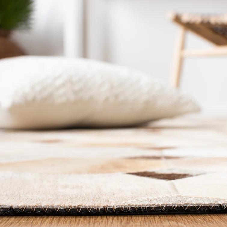 Loon Peak® Bersa Flat Weave Hair On Leather Geometric Rug