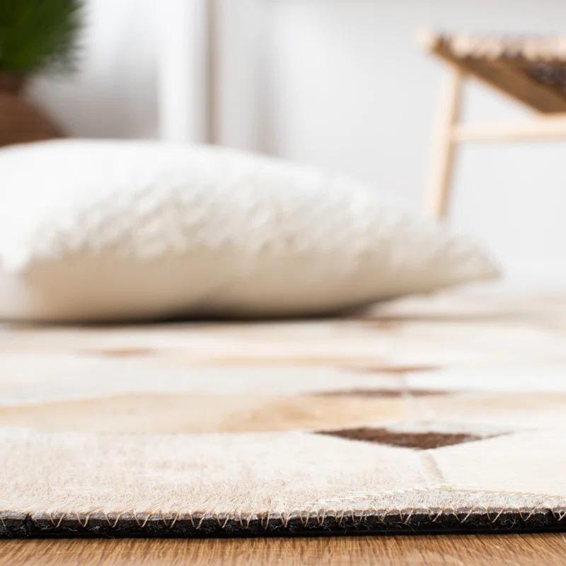 Loon Peak® Bersa Flat Weave Hair On Leather Geometric Rug