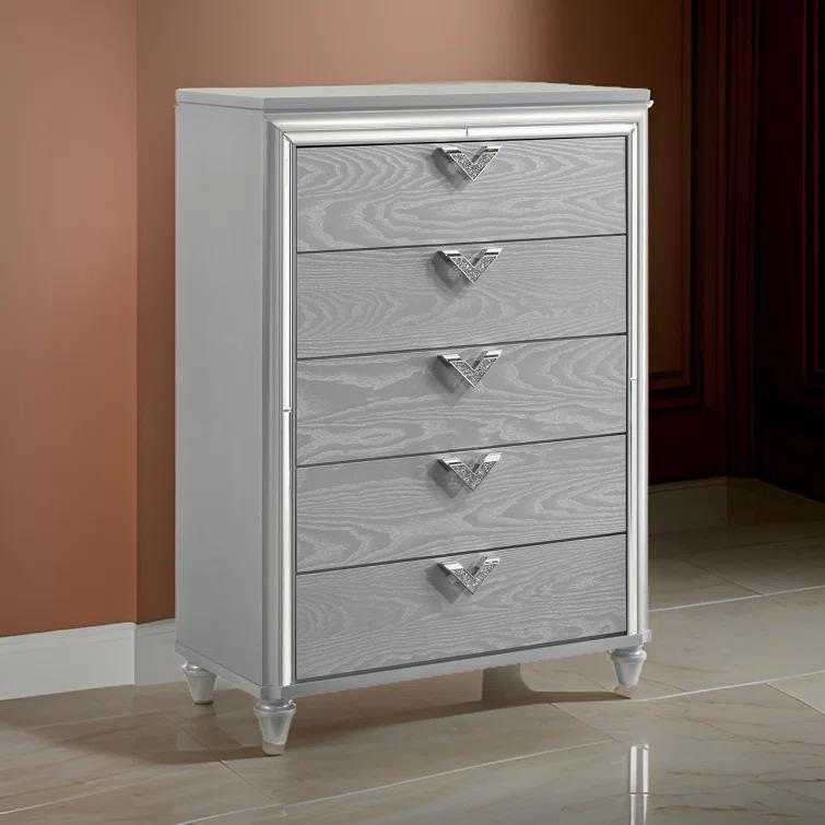 Benjara Haley Tall Dresser Chest, V Shaped Glittering Metal Handles, Light Silver