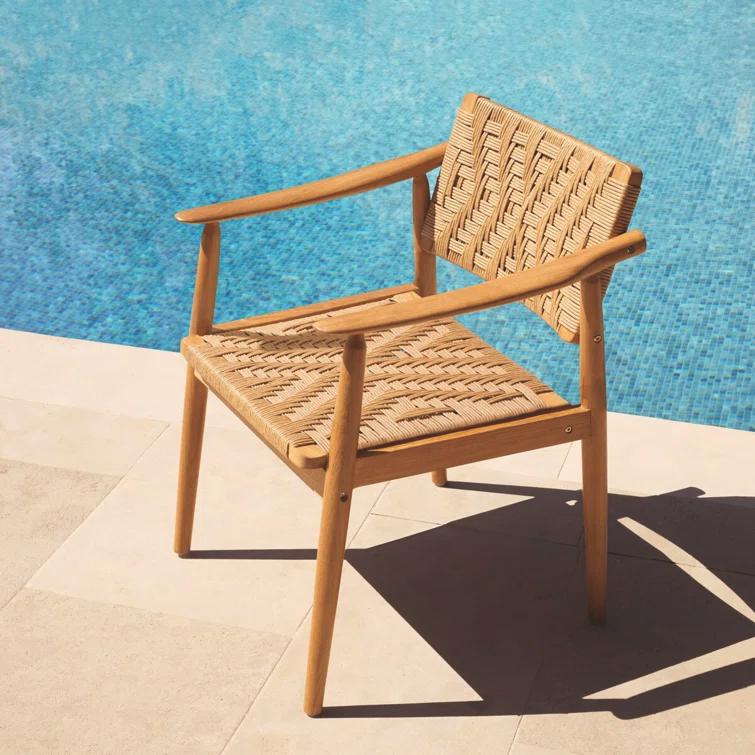 Eichholtz Coral Bay Polyethylene (PE) Wicker Wicker Outdoor Dining Armchair