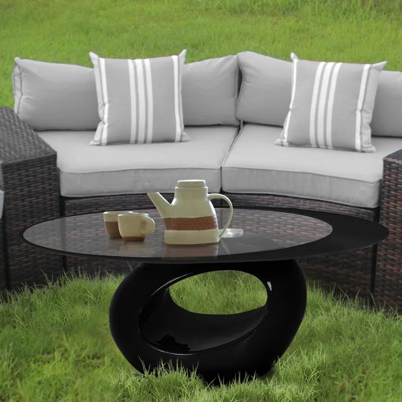 Orren Ellis Glass Top Coffee Table