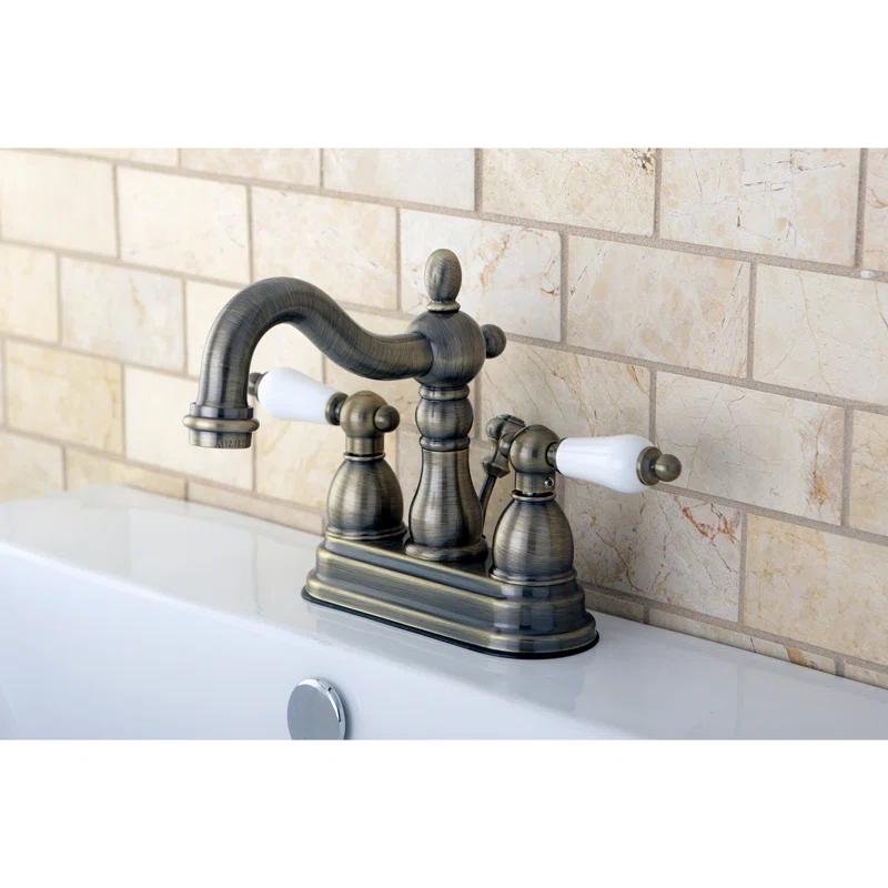 Kingston Brass Heritage Two-Handle 3-Hole Deck Mount 4" Centerset Bathroom Faucet with Plastic Pop-Up