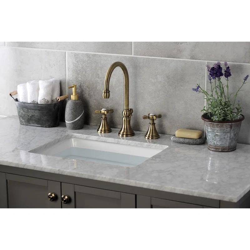 Kingston Brass Essex Two-Handle 3-Hole Deck Mount Widespread Bathroom Faucet with Brass Pop-Up Drain