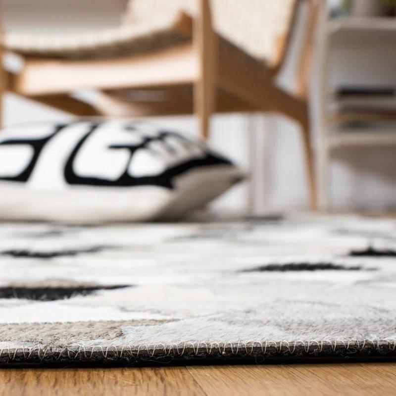 Loon Peak® Brentnal Flat Weave Hair On Leather Geometric Rug